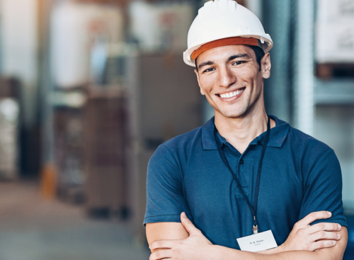Young construction worker smiling