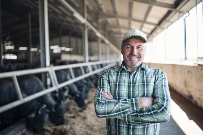 Farmer standing in an agricultural facility